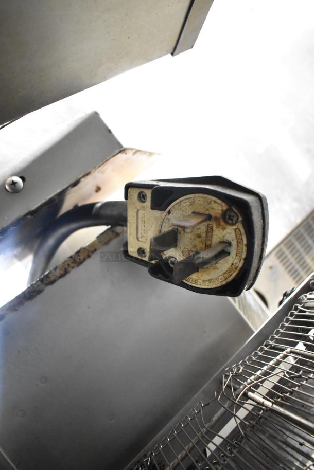 Turbochef HhC2020 electric conveyor oven plug, 208/240V, 3-phase, visible wear on connector, metal construction.