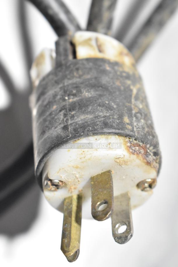 Close-up of a used electrical plug for Everest EPR2 commercial prep table, showing signs of wear and rust.