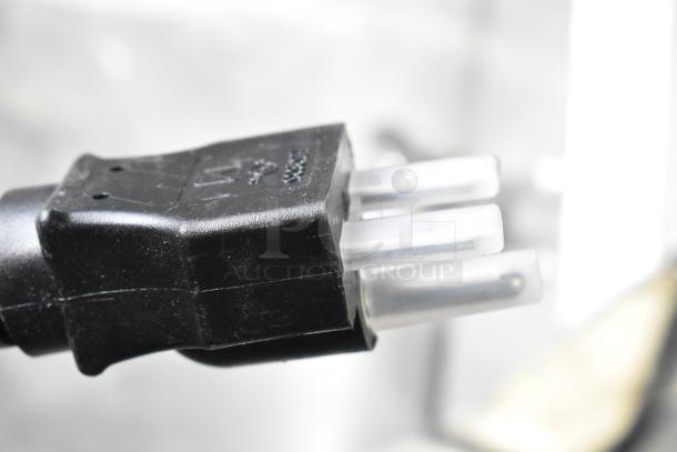 Close-up of the power plug of a Vollrath Cayenne FTA 8024 commercial electric griddle, 220 volts, 1 phase.