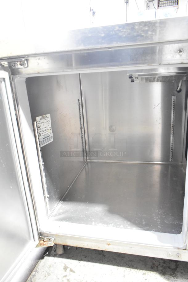 Continental CFB67-BS commercial work top freezer with 2 drawers, 1 door, on casters. Features 115V, 1 phase, interior label visible.