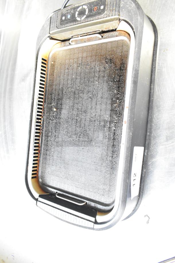 TWRG-200 Countertop Smokeless Grill, 120V, 1 Phase, model showing signs of wear, control panel visible, caution label.