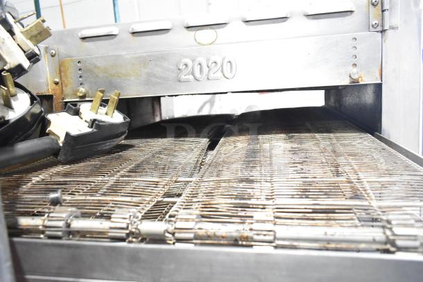 Turbochef HhC2020 commercial rapid cook oven with conveyor, 208/240V, 3-phase; visible plugs, model "2020" on unit.