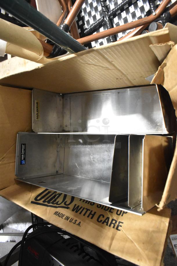 Lot includes a San Jamar lid dispenser inside a cardboard box; visible label indicates model. Mixed items in various conditions.