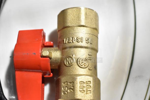 Brass valve with red handle, marked "1/2 PSI 5B C5A 600 WOG," showing quality construction and durability.
