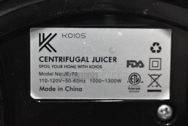 Koios centrifugal juicer, model JE-70, 1000-1300W, 110-120V, made in China. Features include FDA compliance and recycling markings.