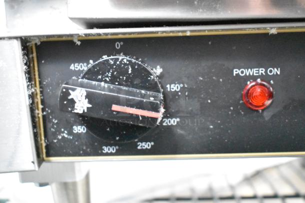 Close-up of the control knob on a Star GX20IG Panini Press. Shows temperature settings up to 450°F and a red power indicator light.