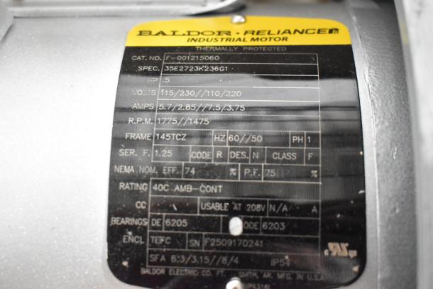 Baldor Reliance industrial motor label on Hobart 425FD4503 garbage disposer; 1/2 hp, 120/208-240V, model details visible.