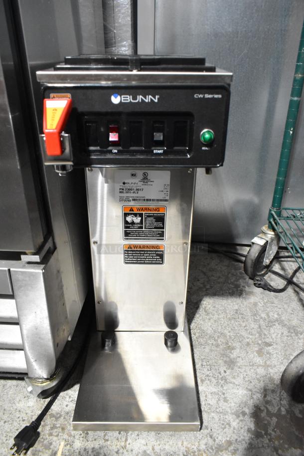 Brand new 2025 Bunn CWTF15-APS coffee machine, countertop model, 120V, with scratch and dent. Warning labels visible.