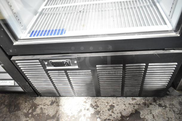 Habco SE18 cooler, single-door reach-in merchandiser. Features a temperature control panel. 115 volts, 1 phase.