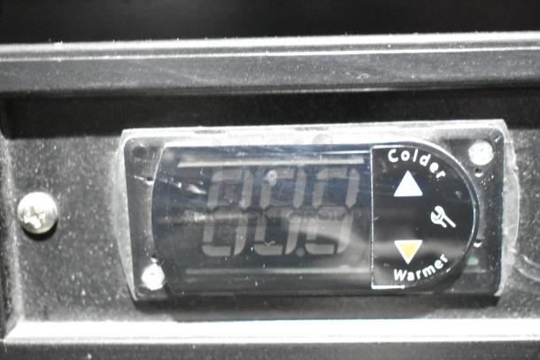 Digital temperature display of Habco SE18 Reach In Cooler Merchandiser showing controls and temperature level.