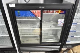 2022 True GDM-41SL-54-HC-LD commercial 2-door reach-in cooler, 115 volts, glass doors, branded graphics, excellent condition.