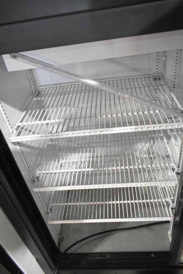 2022 True GDM-41SL-54-HC-LD commercial cooler interior with white shelves, good condition. 115 Volts, 1 phase.