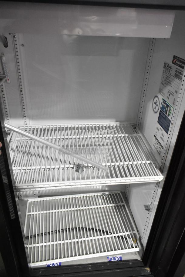 2022 True GDM-41SL-54-HC-LD 2 Door Cooler, white interior, adjustable shelves, labels showing energy specs.