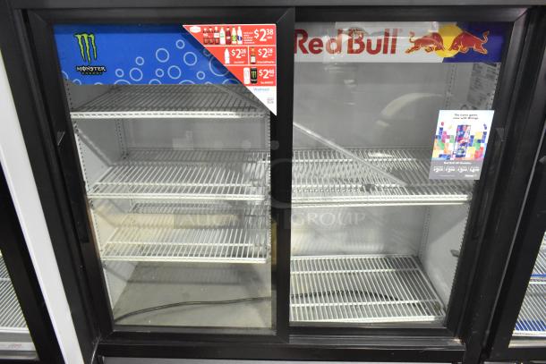 2022 True GDM-41SL-54-HC-LD cooler, 2-door, glass front, 115V, decorated with Monster and Red Bull branding.