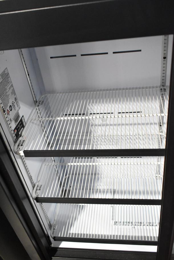 QBD CD4154-HC commercial two-door cooler, clean interior, adjustable shelves, 115V, 1 Phase, model label inside.