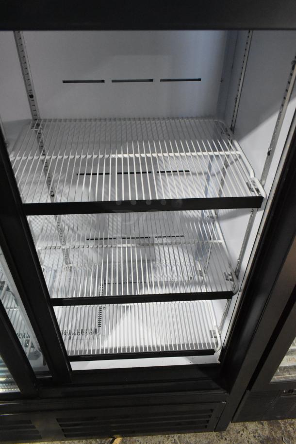 QBD CD4154-HC Commercial 2 Door Reach In Cooler, white interior, adjustable shelves, 115V, 1 Phase, excellent condition.