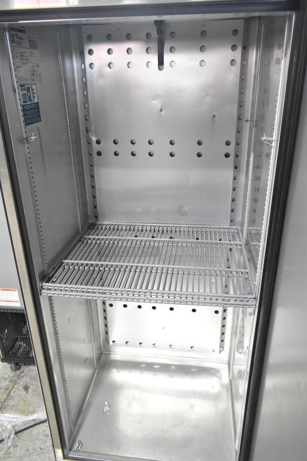 True T-19F-HC commercial single door freezer, 115 volts, 1 phase, interior shelves, silver finish, visible label with model and specs.
