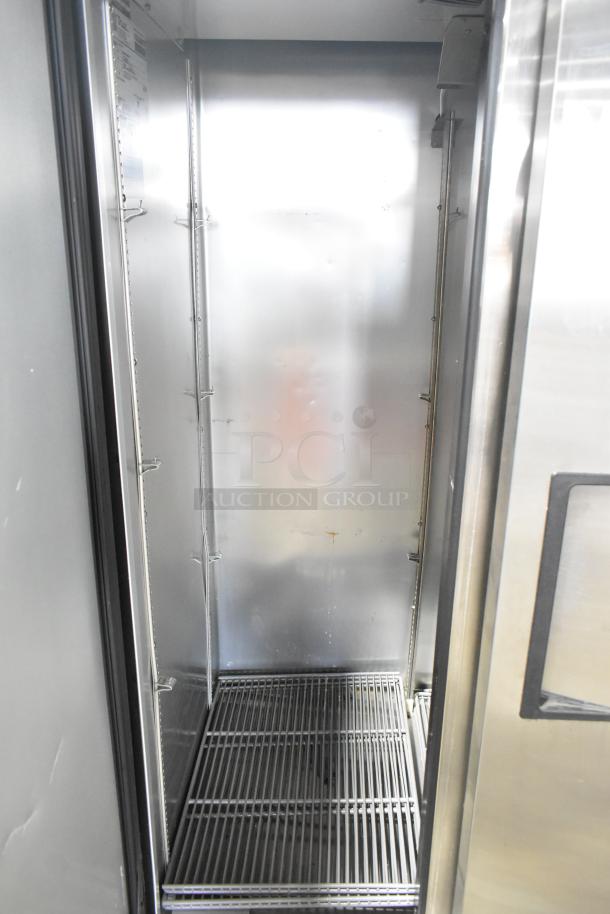 2021 True T-35-HC 2 Door Reach-In Cooler, stainless interior, shelving, 115V, excellent condition.
