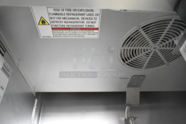 2021 True T-35-HC commercial cooler interior, showing safety warning labels and a vent. Model suitable for 115 volts, 1 phase.