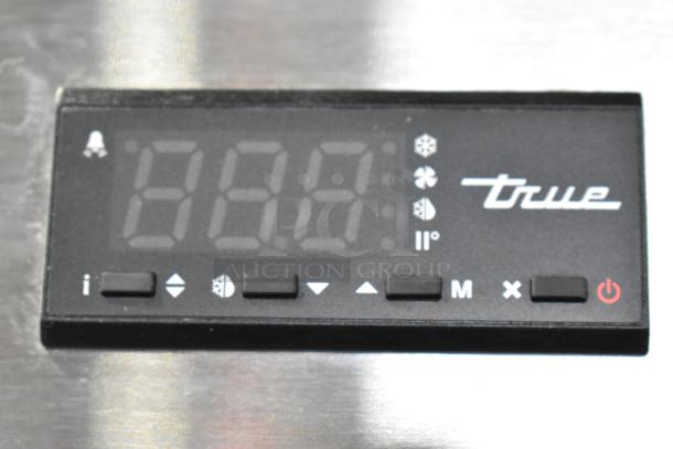 Control panel of the 2021 True T-35-HC Commercial 2 Door Reach In Cooler, showing digital display and control buttons.