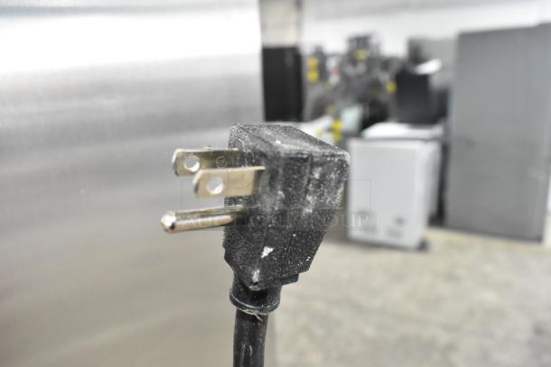 Power plug of 2021 True T-35-HC commercial reach-in cooler. 115 volts, 1-phase. Close-up view of electrical plug.