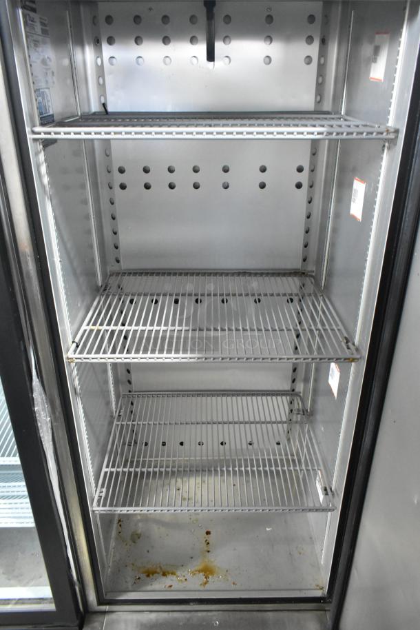 2021 True T-19F-HC commercial single door reach-in freezer, stainless steel, with three shelves, 115 volts, good condition.