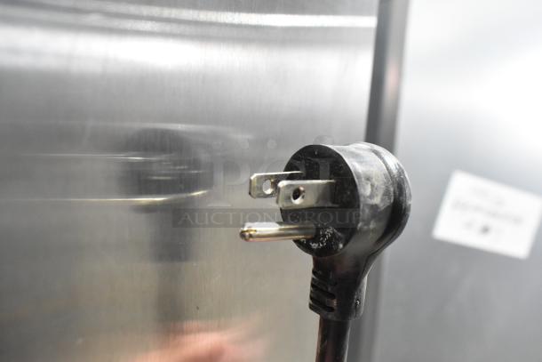 2021 True T-19F-HC freezer detail, showcasing the plug. 115V, 1 Phase, stainless steel finish, commercial use.