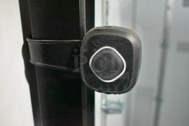 2019 Habco SE18 cooler detail showing door handle and part of frame, highlighting brand logo. Condition appears used.