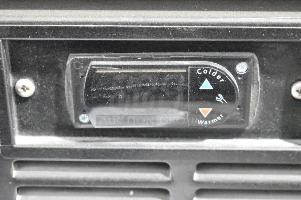 Close-up of a temperature control panel on a 2019 Habco SE18 commercial cooler. Display shows colder/warmer settings.