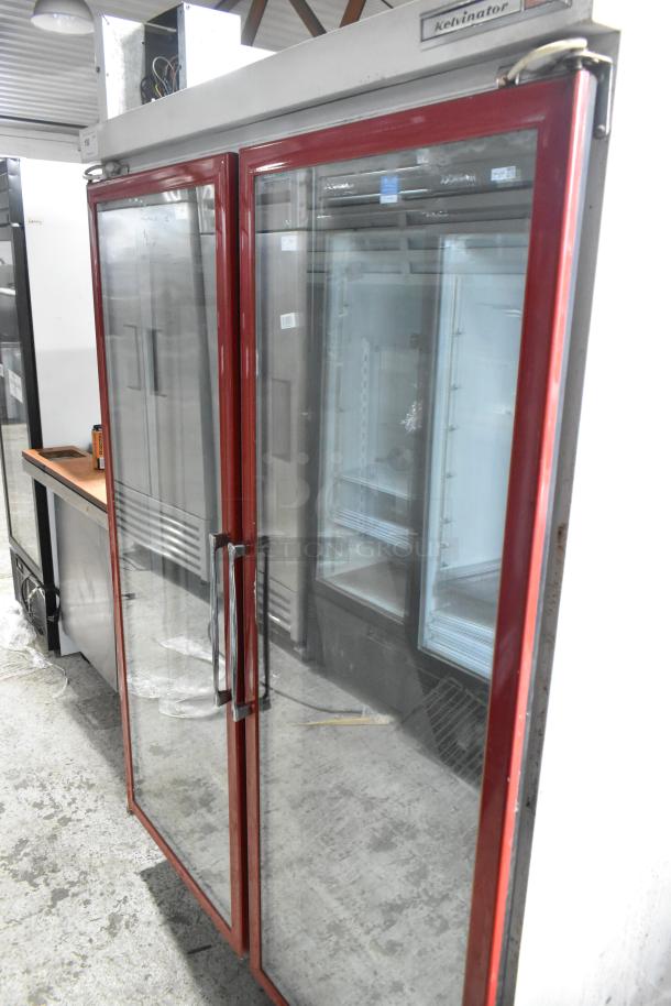 Kelvinator Commercial 2 Door Reach In Merchandiser with glass doors, red frame. Appears in used condition.
