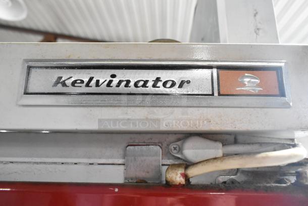 Kelvinator Commercial 2 Door Reach In Merchandiser, visible logo, metal casing, slight wear.
