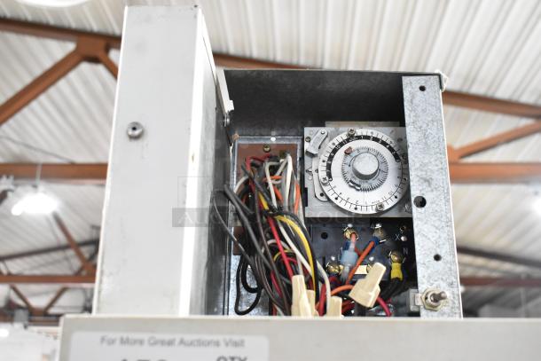 Interior view of Kelvinator Commercial 2 Door Reach In Merchandiser showing wiring and a dial with numerical settings.