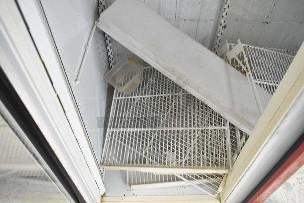 Kelvinator Commercial 2 Door Reach In Merchandiser with interior shelves, visible wear, and some rust on edges.