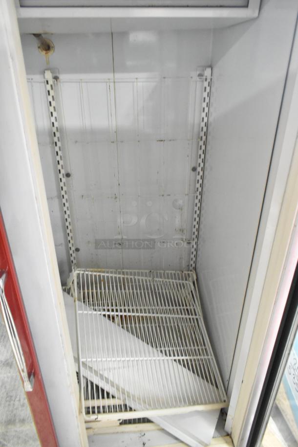 Kelvinator Commercial 2 Door Reach In Merchandiser, white interior, adjustable wire shelves, visible wear and stains, good condition.