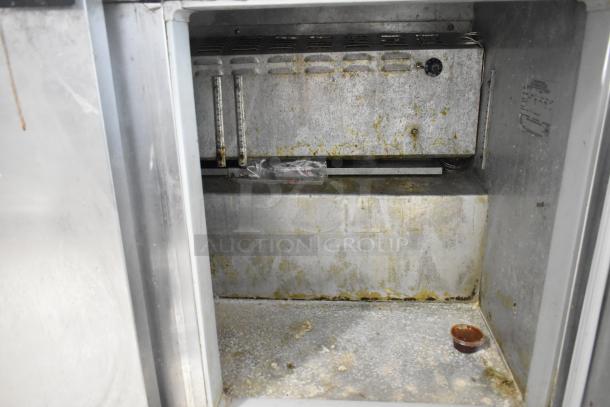 Continental SW48-18M Commercial prep table interior showing used condition, visible wear, and rust. 115V, 1 Phase.