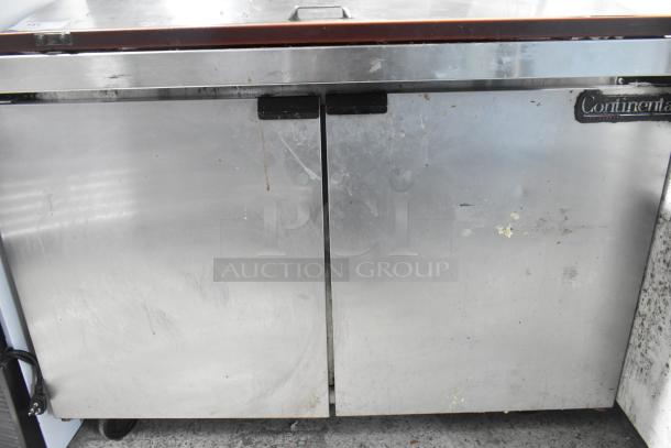 Continental SW48-18M sandwich prep table, stainless steel, used condition with visible wear, commercial casters, 115V.
