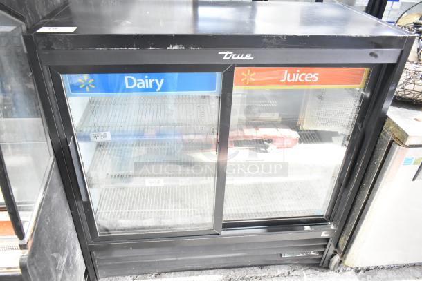 2018 True GDM-41SL-48-HC-LD cooler; commercial 2-door reach-in, glass doors, Dairy and Juices signage, good condition.