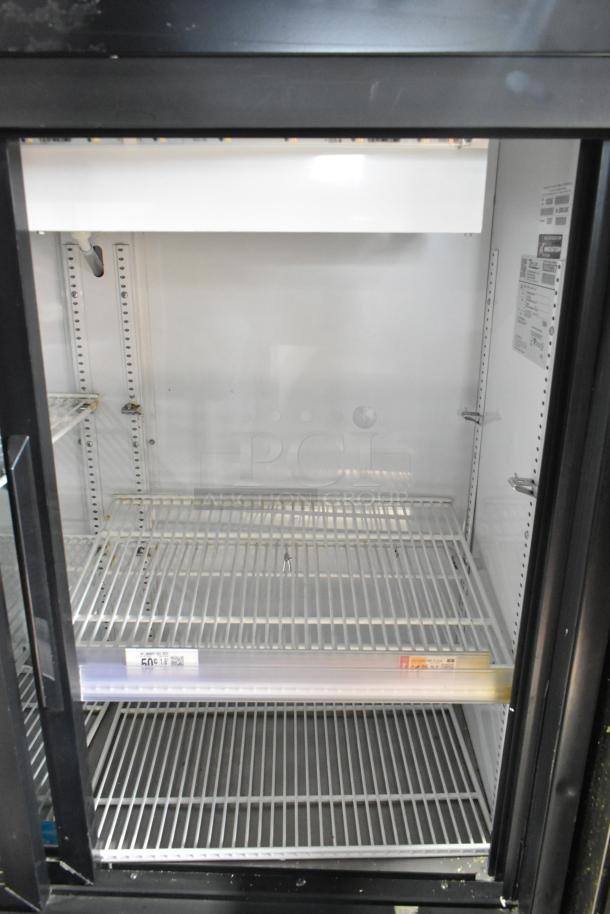 2018 True GDM-41SL-48-HC-LD commercial cooler, 2-door, 115V, clean interior, shelving, labels visible, good condition.