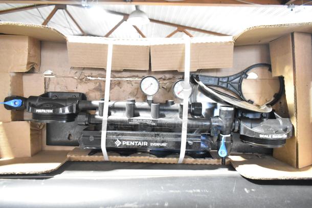 Pentair Everpure water filtration system, pre-owned, no cartridges, includes gauges, in original packaging, boxed.