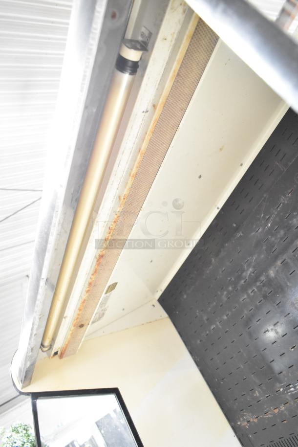 Federal Industries RSSM460SC merchandiser interior. Visible shelf area and lighting; shows signs of wear.