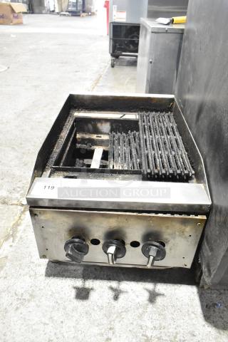 Commercial countertop gas charbroiler grill with three control knobs, steel exterior, and visible wear.