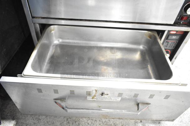 Hatco HDW-2 warming drawer, commercial, 2 drawers, 120 volts, stainless steel, visible wear, label notes load capacity.