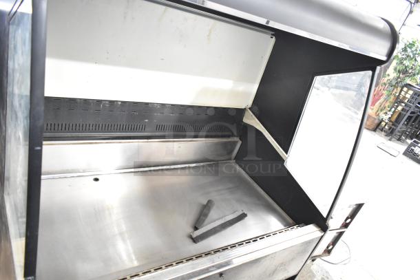 Federal Industries RSSM460SC commercial reach-in merchandiser, clean, 115/208-230 volts, 1 phase, stainless steel interior.