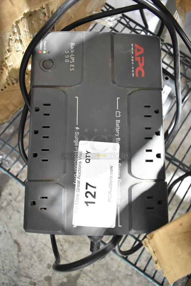 APC Back-UPS ES 550 uninterruptible power supply with multiple outlets and visible label. Good condition.