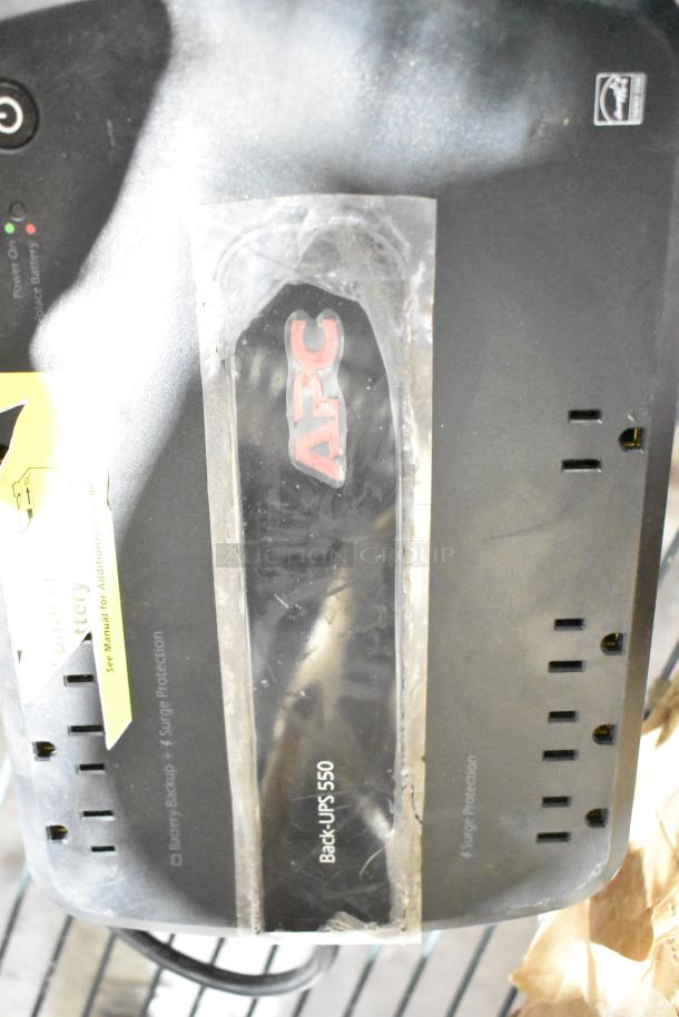 APC Back-UPS 550, black, uninterruptible power supply, visible labels, includes surge protection and battery backup.