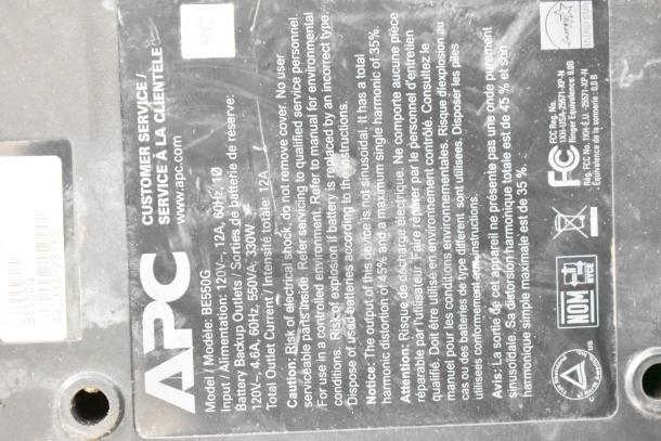 APC Uninterruptible Power Supply, Model BE550G. Visible labels detailing specifications and warnings. Condition appears used.
