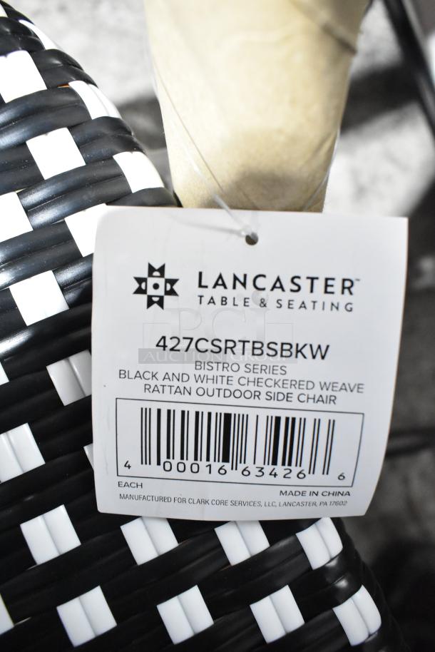 Lancaster Table & Seating black and white checkered rattan side chair. New, tag shows model 427CSRTBSBKW. Scratch and dent condition.