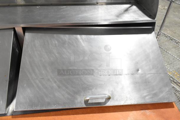 Beverage Air commercial sandwich salad prep table with Bain Marie mega top, stainless steel, on casters, showing some wear.