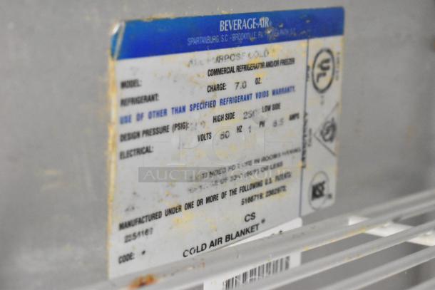 Beverage Air prep table label, showing refrigerant charge, voltage, and electrical details. Model tag visible with manufacturing code.