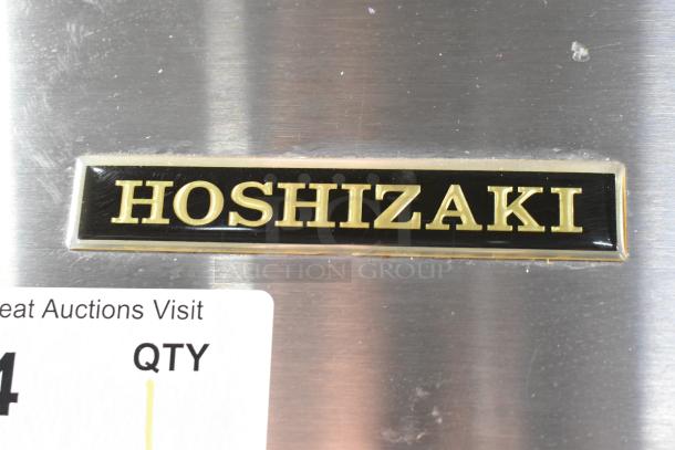 Hoshizaki CF1B-FS commercial freezer label on stainless steel. Black and gold logo, indicating brand and model details.